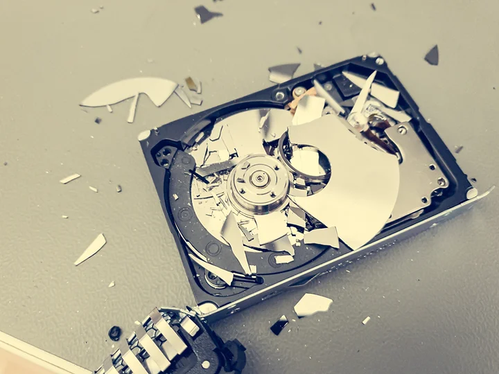 Shredded hard-drive fragments after certified on-site destruction